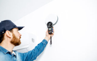 HVAC technician performing a home energy audit