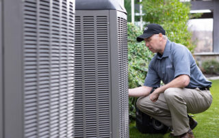 HVAC technician performing AC service