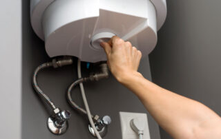 Technician performing water heater service