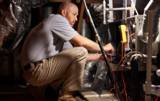 HVAC technician performing furnace service